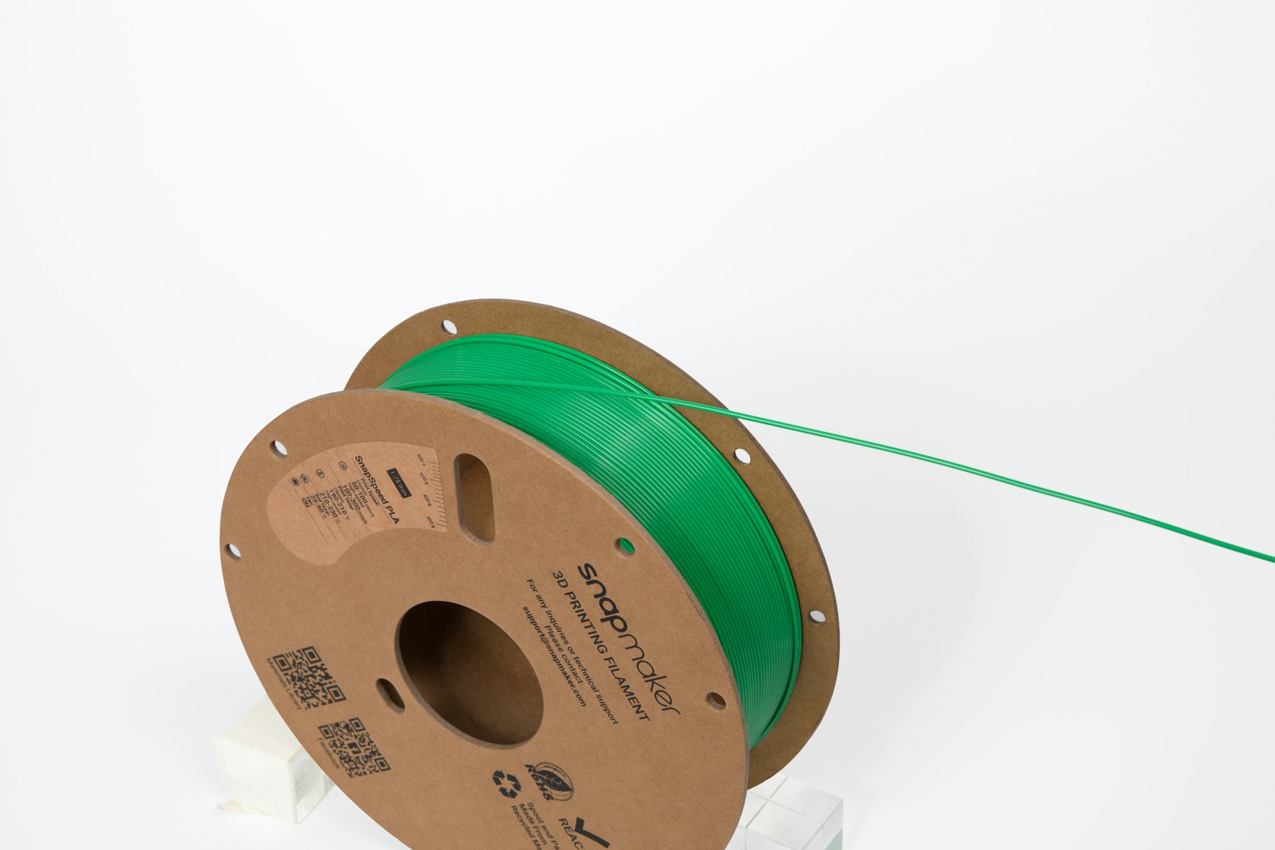 Green PLA filament spool for choosing a 3D printing material