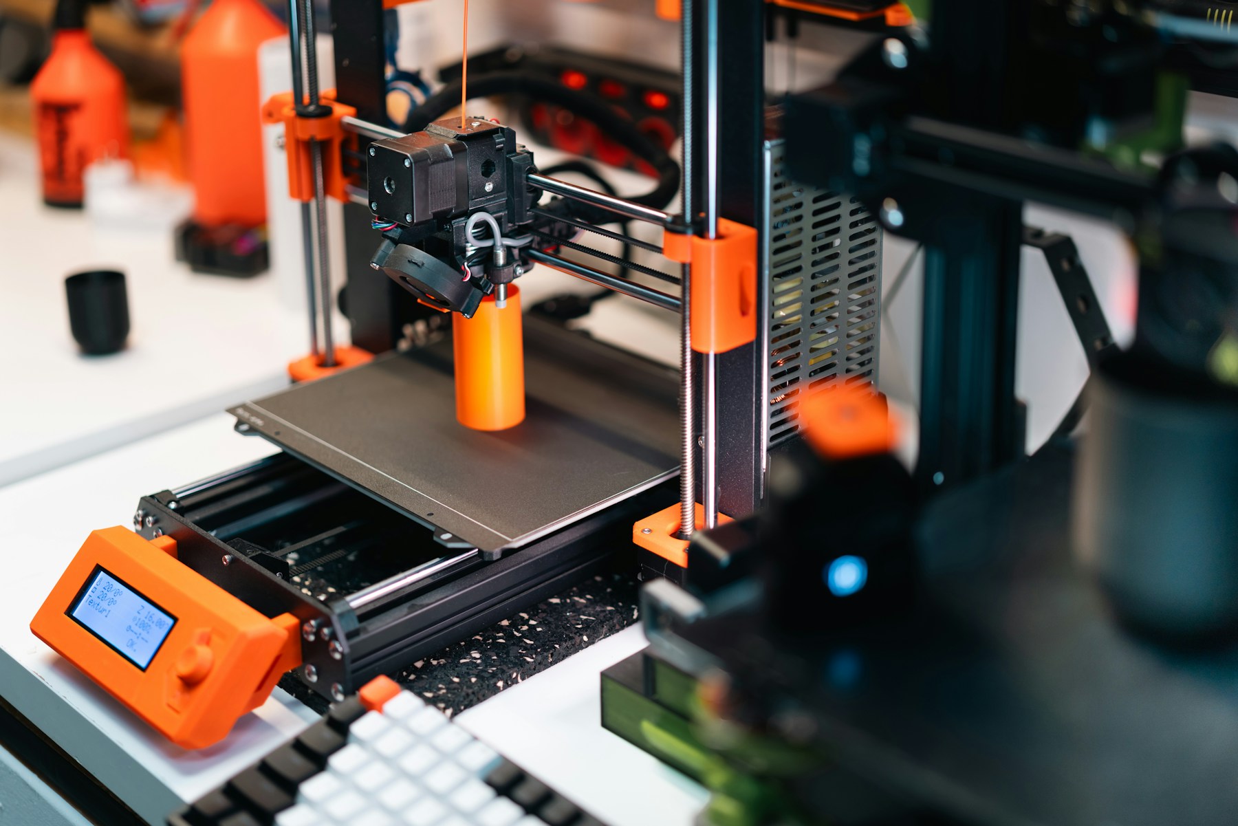 FDM 3D printer printing a model during layer adhesion testing