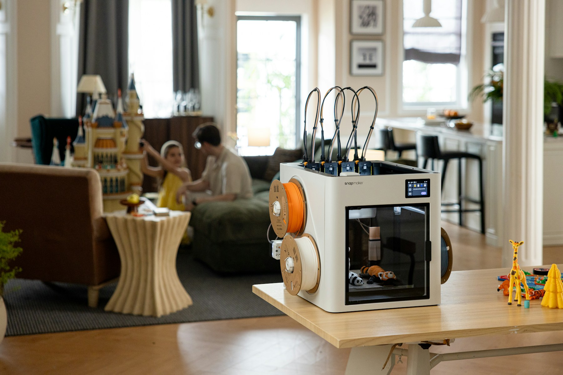 PLA 3D printer and filament rolls in a home workshop